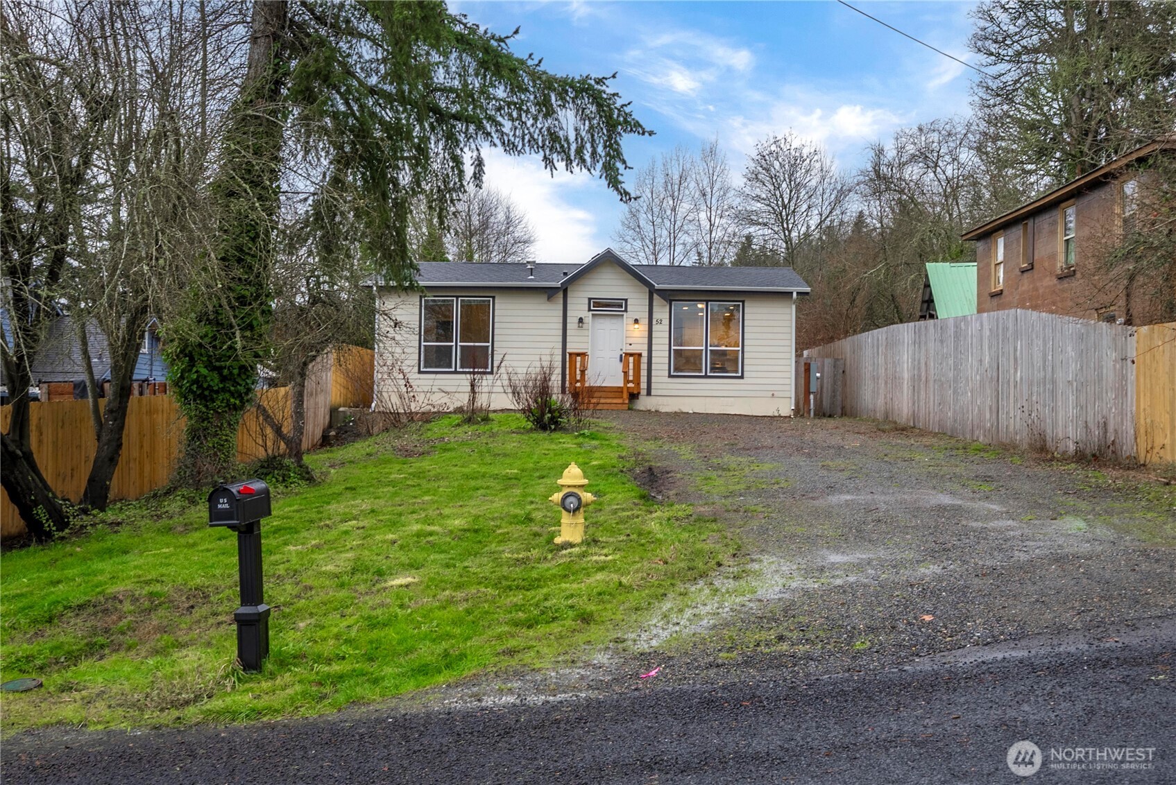 52 Southeast Spring Street Chehalis, WA 98532 - Photo 2 of 40 a front view of a house with a yard and trees