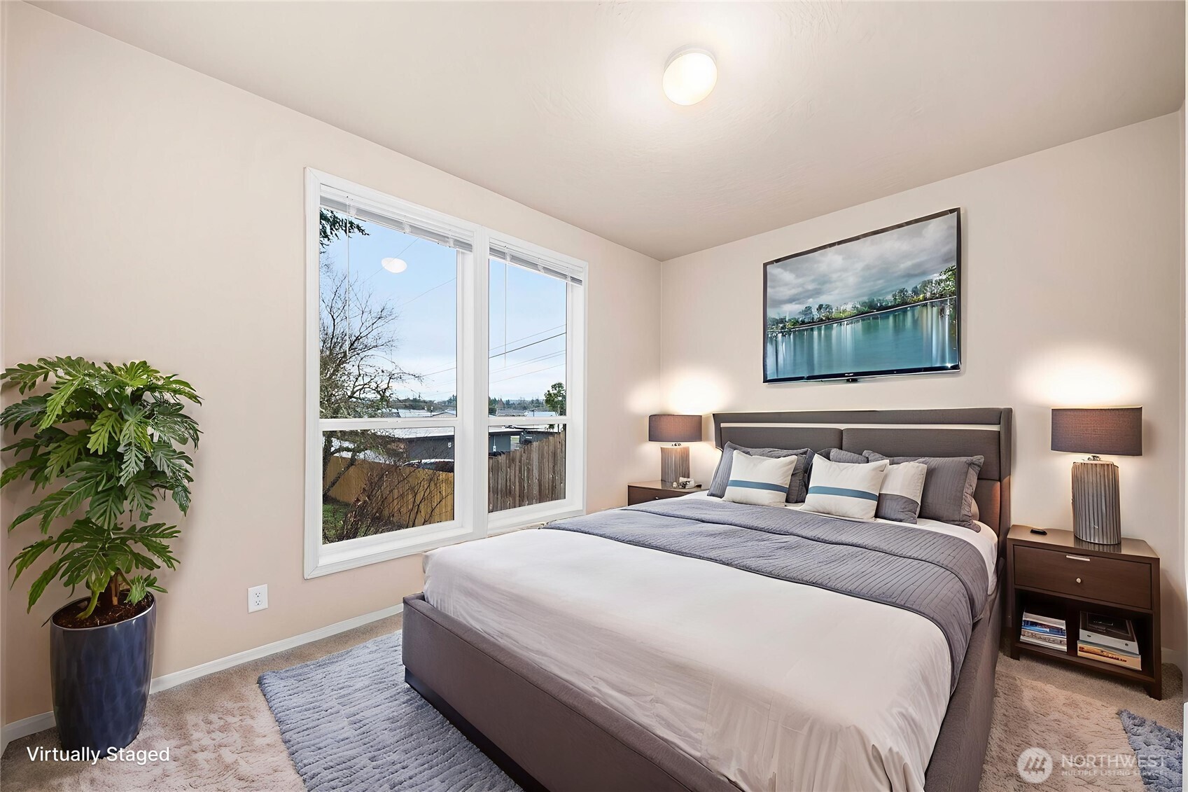 52 Southeast Spring Street Chehalis, WA 98532 - Photo 24 of 40 a bedroom with bed and a potted plant