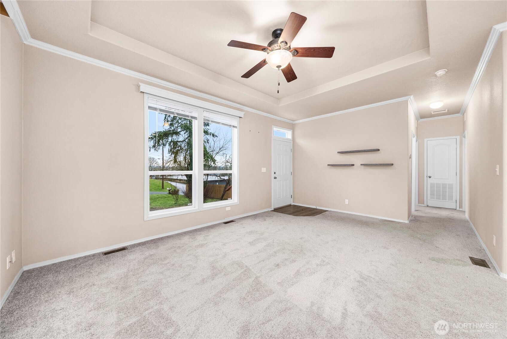 52 Southeast Spring Street Chehalis, WA 98532 - Photo 26 of 40 an empty room with windows and ceiling fan