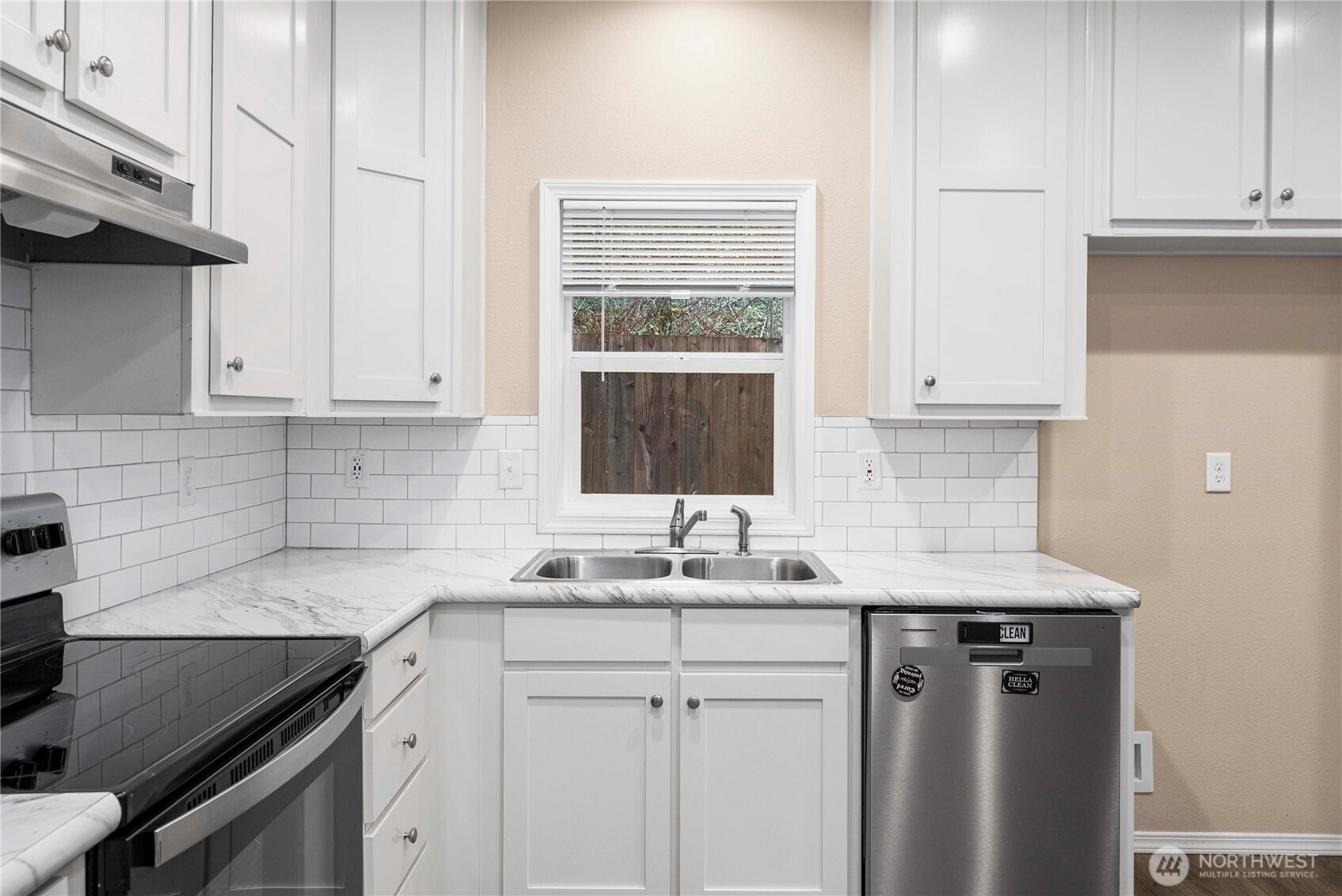 52 Southeast Spring Street Chehalis, WA 98532 - Photo 8 of 40 a kitchen with stainless steel appliances granite countertop white cabinets and a sink