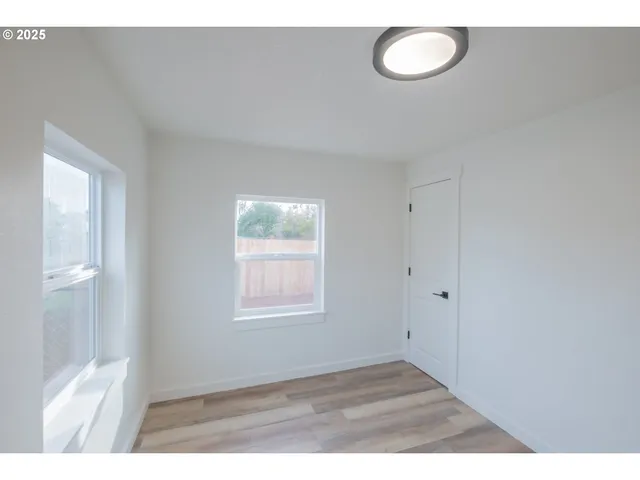 a bathroom with a bathtub sink vanity and toilet