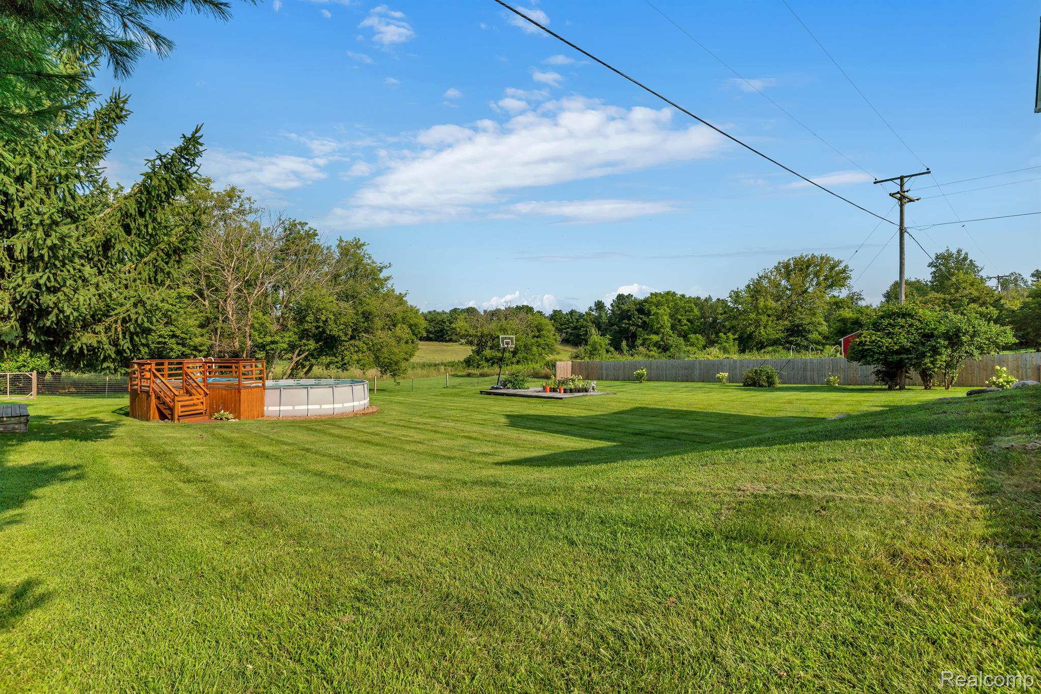 5389 Bentley Lake Road Howell, MI 48843 - Photo 40 of 48 Above ground pool and 2 sheds in this backyard