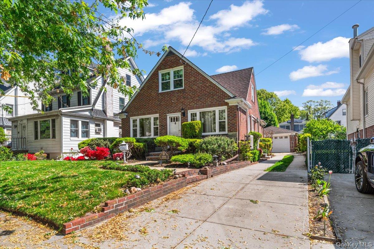 183-41 Dalny Road Queens, NY 11432 - Photo 1 of 31 a front view of a house with garden