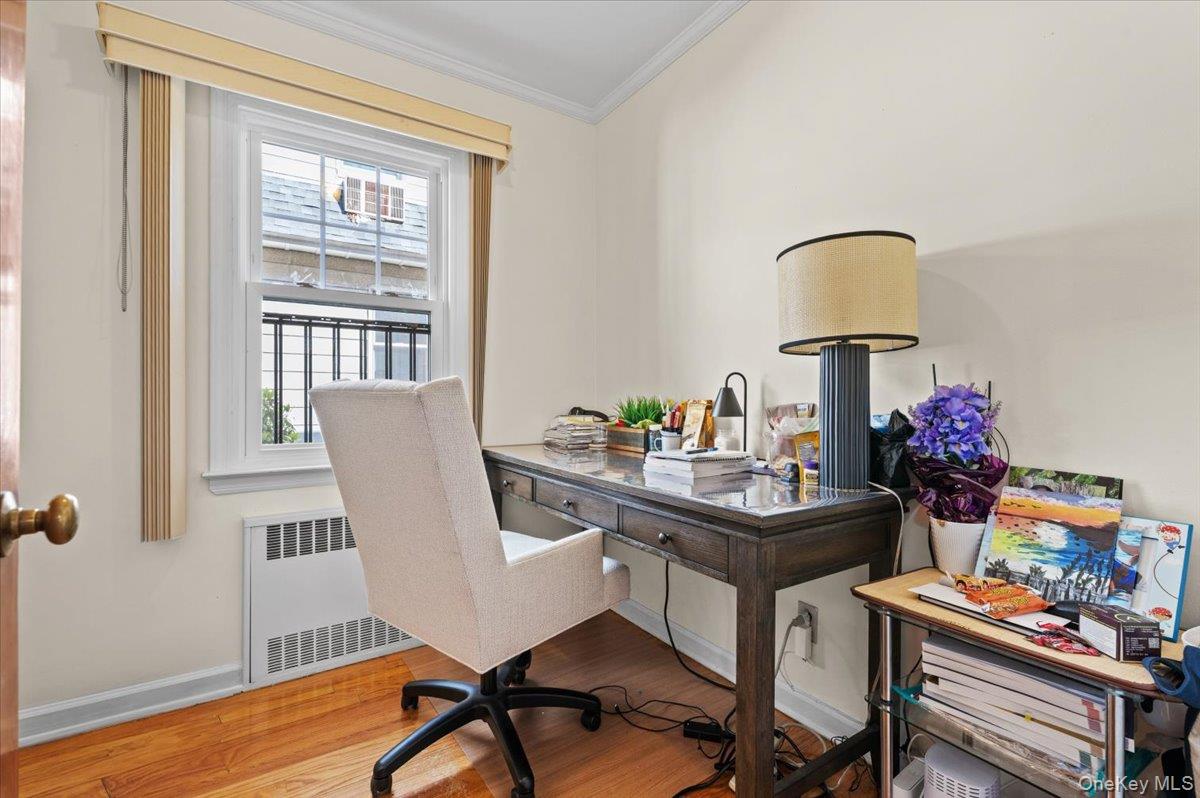 183-41 Dalny Road Queens, NY 11432 - Photo 12 of 31 a view of a workspace with furniture and a window