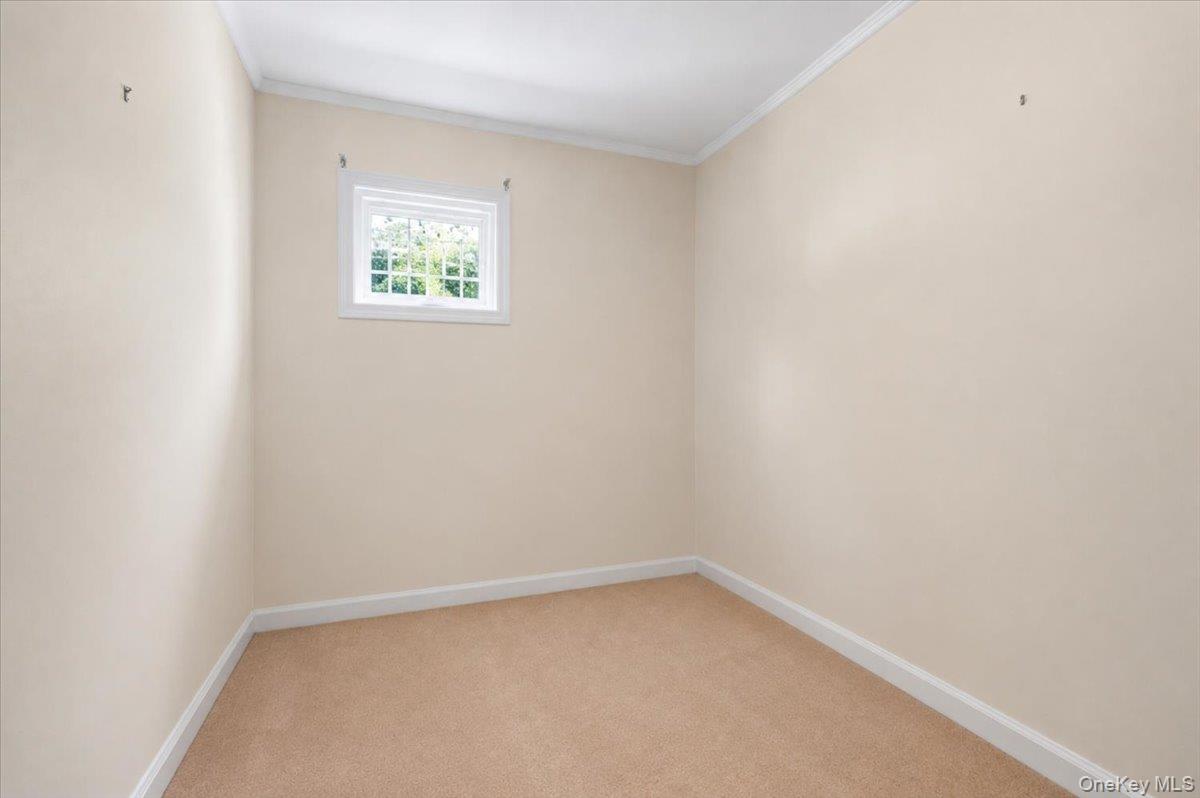 183-41 Dalny Road Queens, NY 11432 - Photo 17 of 31 a view of an empty room with a window