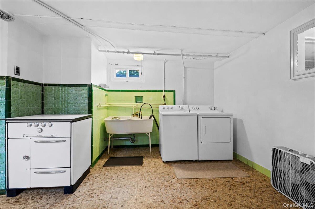 183-41 Dalny Road Queens, NY 11432 - Photo 20 of 31 a utility room with dryer and washer
