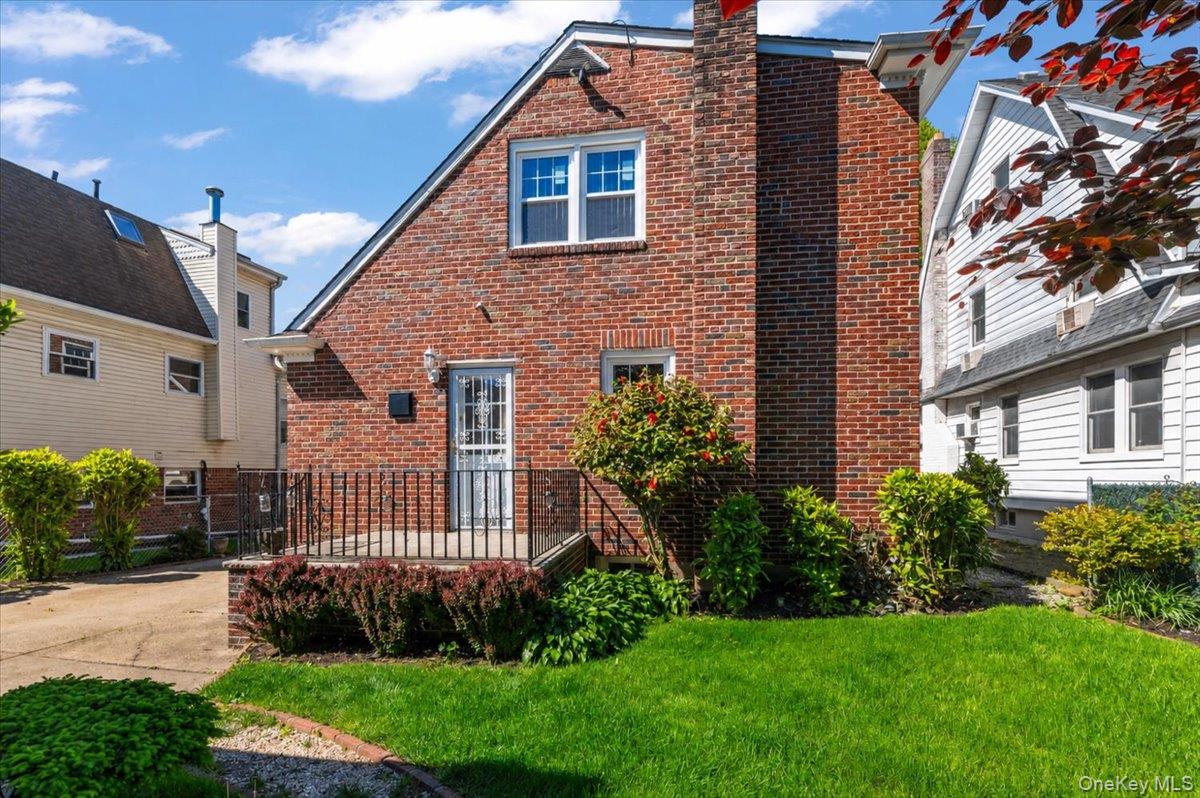183-41 Dalny Road Queens, NY 11432 - Photo 28 of 31 a front view of a house with garden