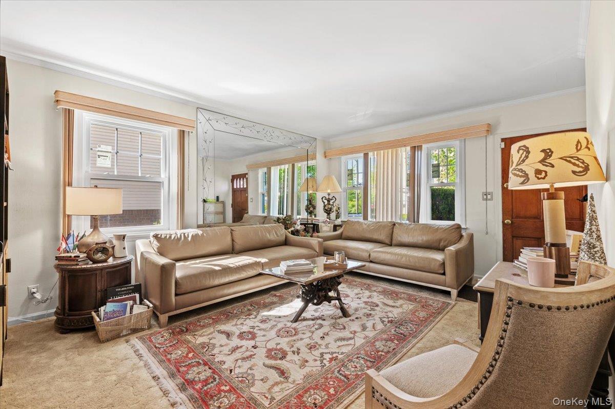 183-41 Dalny Road Queens, NY 11432 - Photo 4 of 31 a living room with furniture and a large window