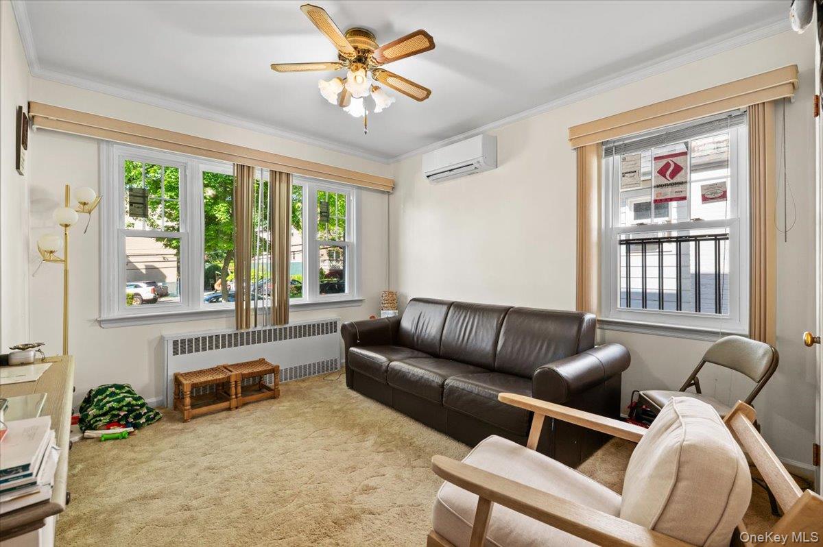 183-41 Dalny Road Queens, NY 11432 - Photo 5 of 31 a living room with furniture and a large window
