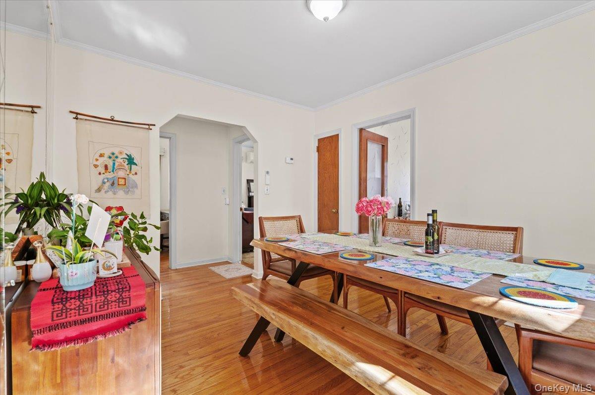 183-41 Dalny Road Queens, NY 11432 - Photo 9 of 31 a living room with furniture and flowers