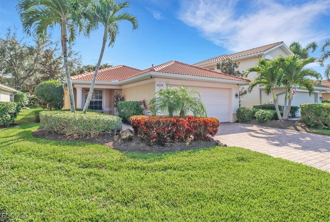 19674 Villa Rosa Loop Estero, FL 33967 - Photo 1 of 33 a view of a house with a yard and potted plants