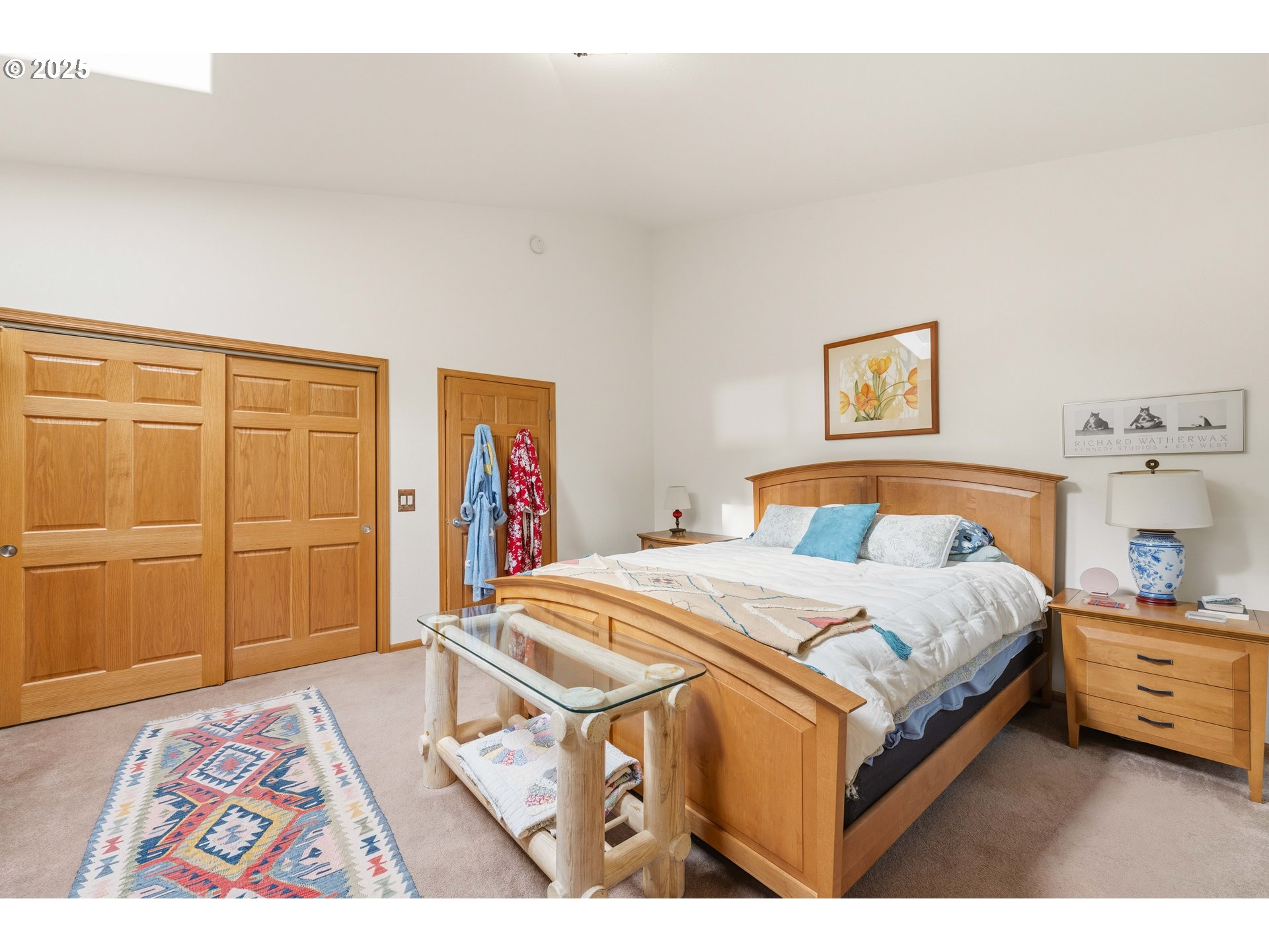 47555 Leeward Street Langlois, OR 97450 - Photo 18 of 45 a bedroom with a bed a dresser and painting on the wall