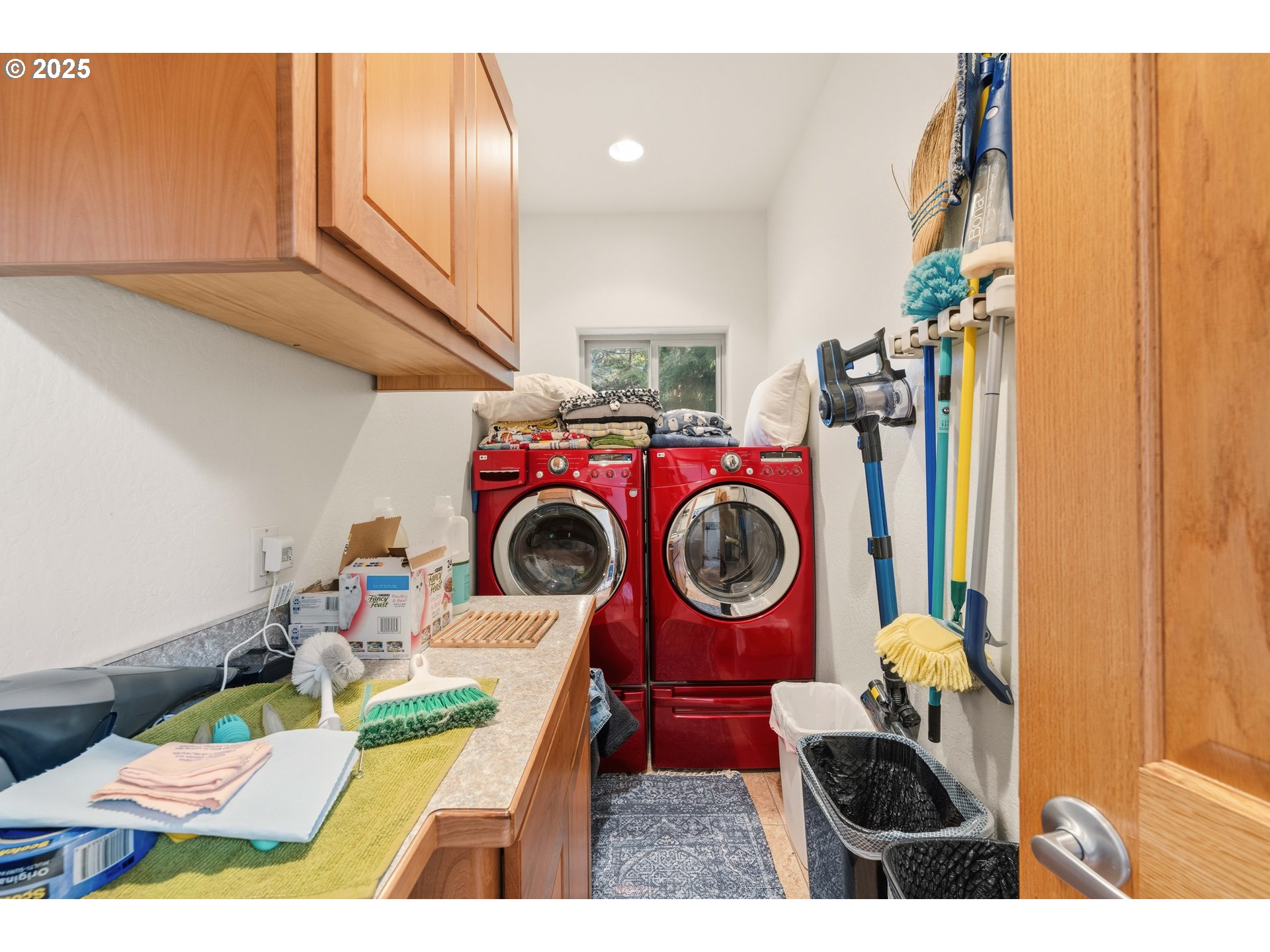 47555 Leeward Street Langlois, OR 97450 - Photo 22 of 45 a utility room with dryer washer and a view of living room