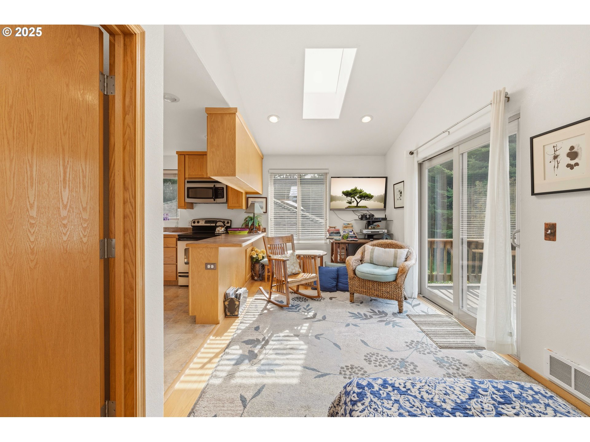 47555 Leeward Street Langlois, OR 97450 - Photo 26 of 45 a living room with furniture and a kitchen