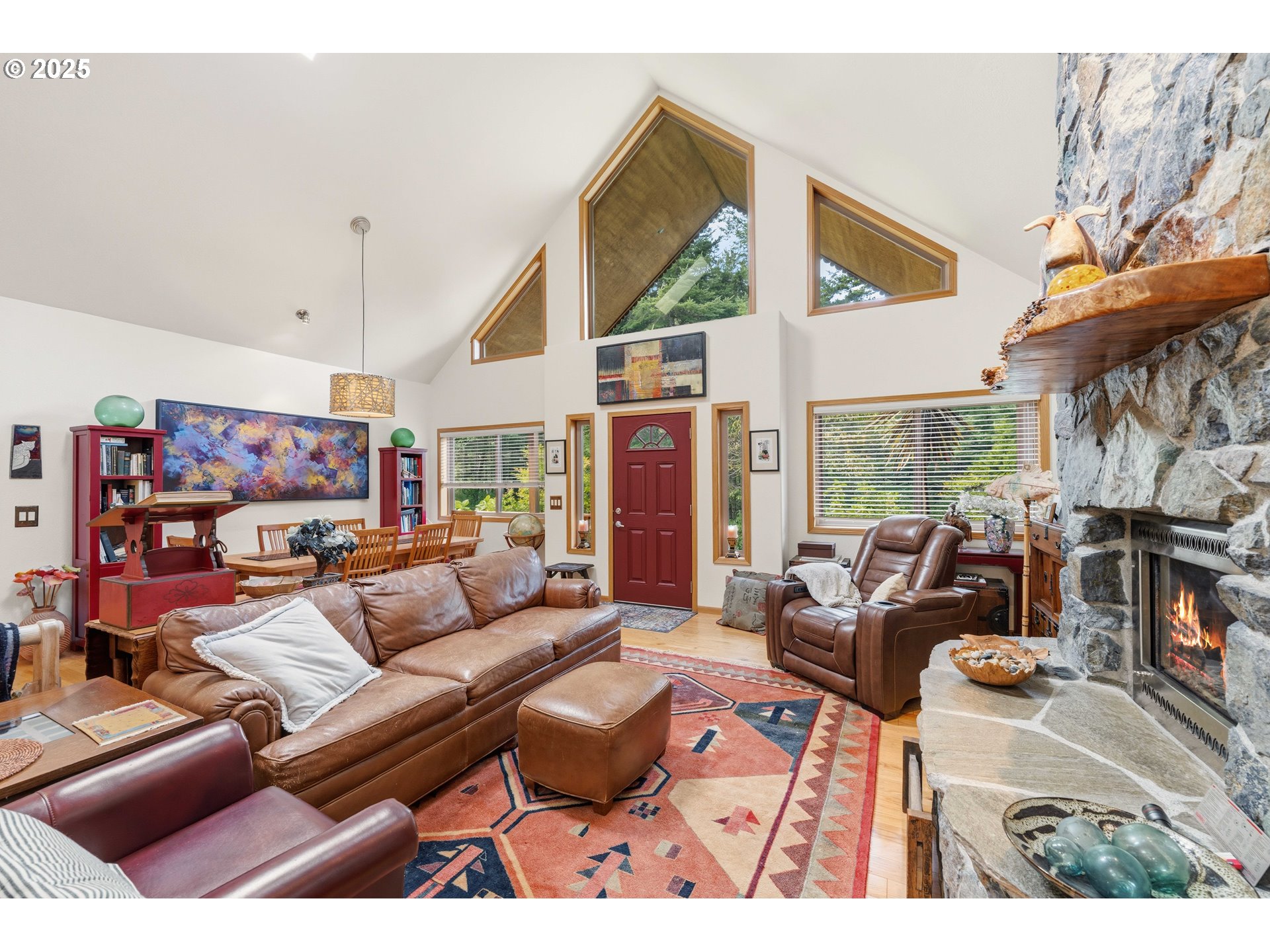 47555 Leeward Street Langlois, OR 97450 - Photo 7 of 45 a living room with furniture a fireplace and a large window