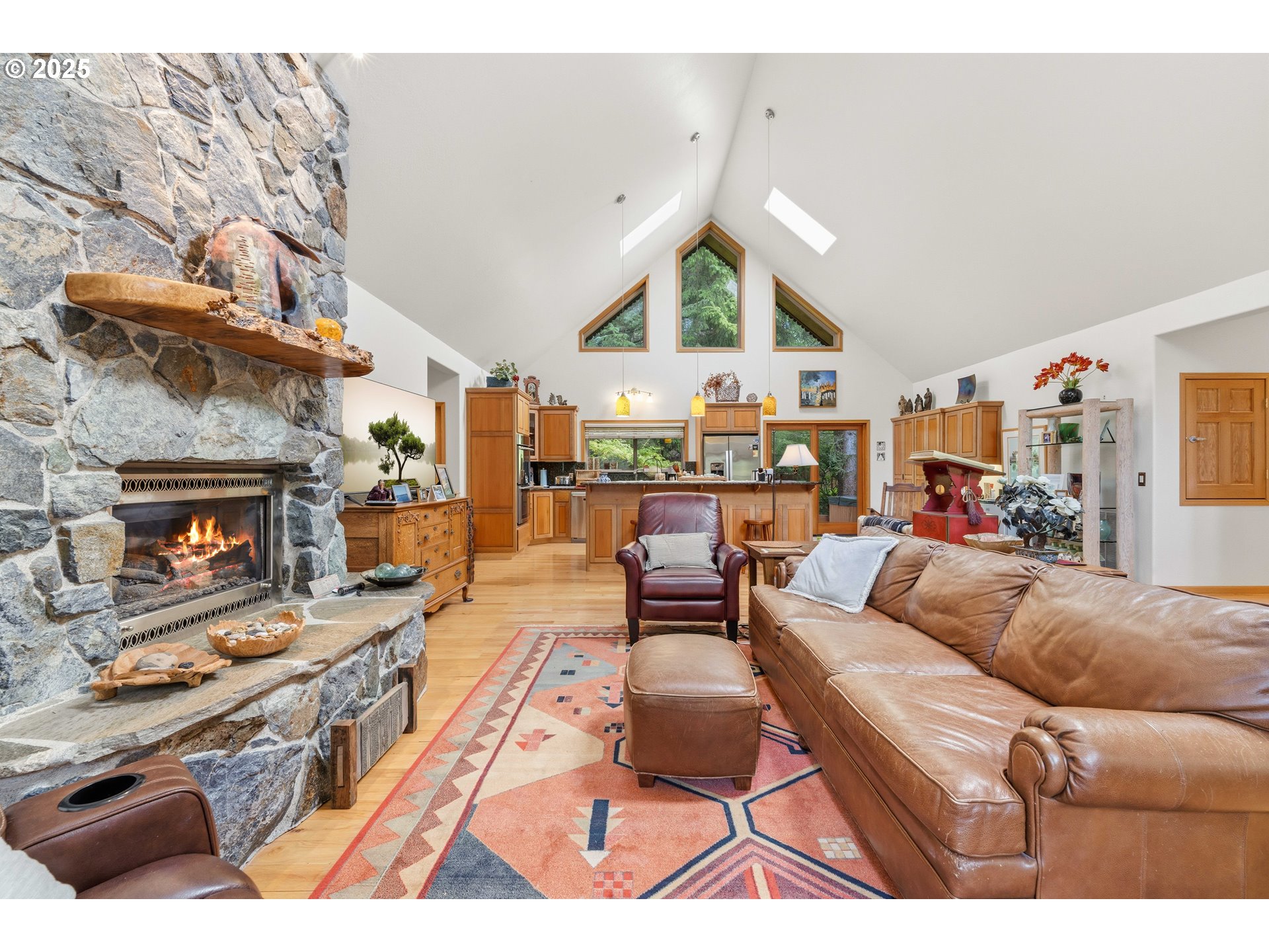 47555 Leeward Street Langlois, OR 97450 - Photo 8 of 45 a living room with furniture and a fireplace