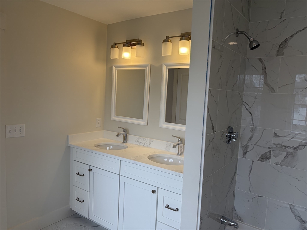 76 Valmor Street Worcester, MA 01604 - Photo 20 of 20 a bathroom with a granite countertop sink mirror and double
