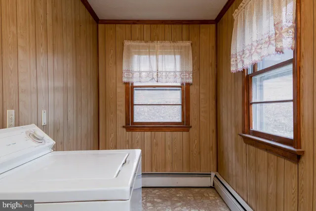 a room with a bed and a window