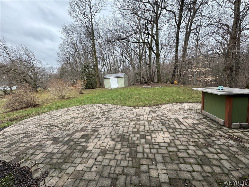 6668 Milestrip Road Orchard Park, NY 14127 - Photo 25 of 30 32 x 16 patio and 16 x 12 shed.