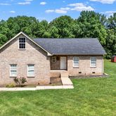 a aerial view of a house with a yard