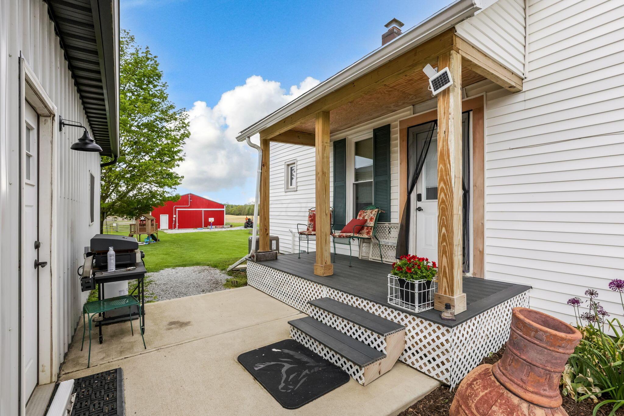 5919 North County Line Road Sunbury, OH 43074 - Photo 44 of 66 Side porch and garage man door