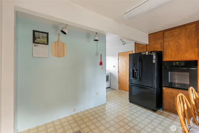 a kitchen with stainless steel appliances a refrigerator and a sink