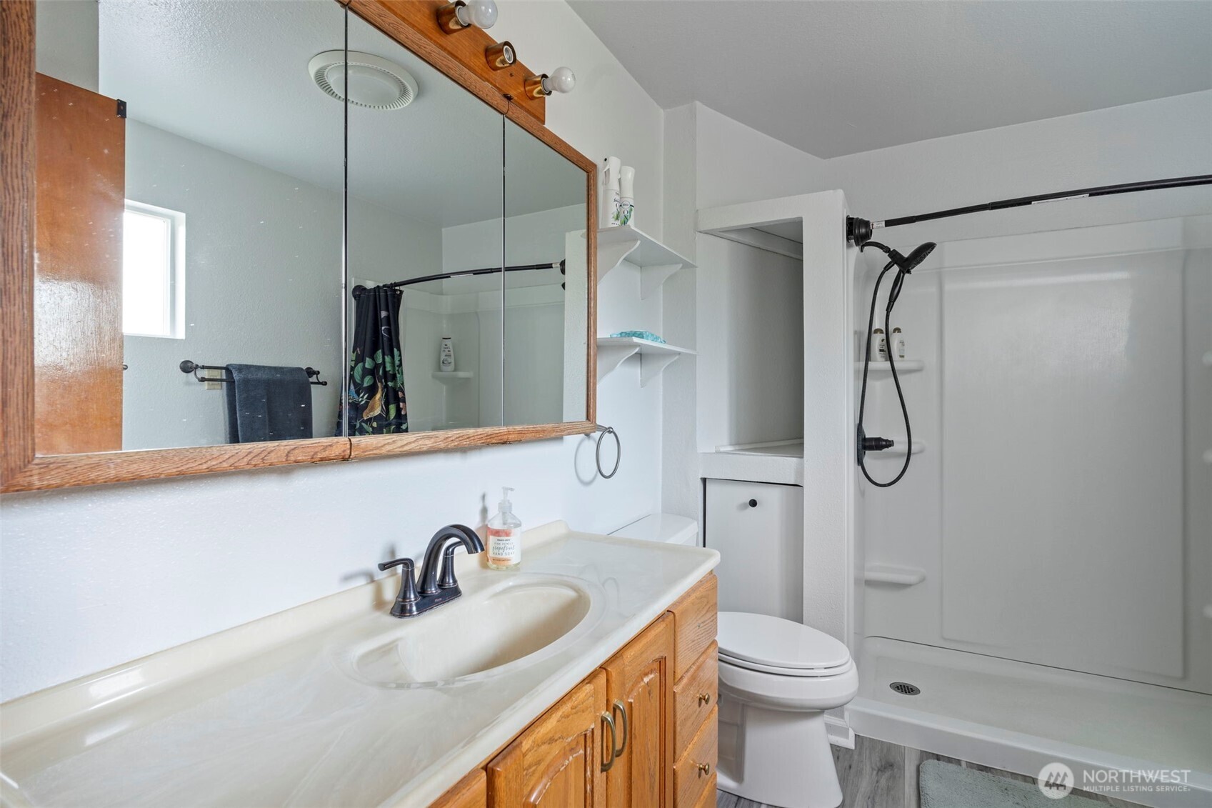 450 Hawkins Road Winlock, WA 98596 - Photo 20 of 40 a bathroom with a granite countertop sink a toilet and shower