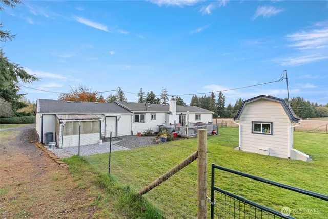 a view of a house with a yard from a balcony
