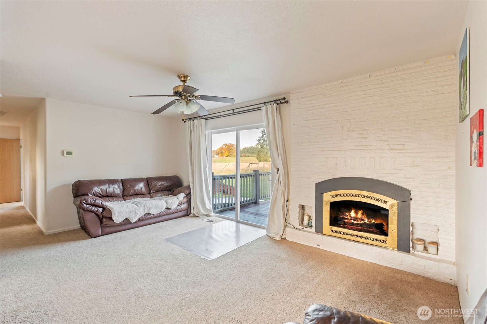 450 Hawkins Road Winlock, WA 98596 - Photo 3 of 40 a living room with furniture and a fireplace
