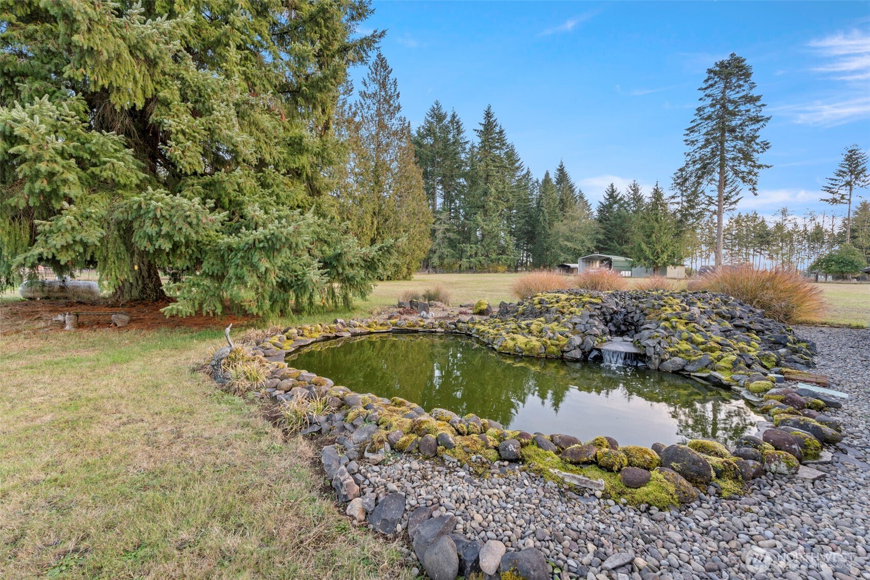 450 Hawkins Road Winlock, WA 98596 - Photo 37 of 40 a view of a lake with large trees