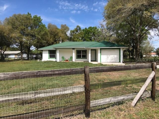 497 Northeast 155th Street Road Citra, FL 32113 - Photo 1 of 1 a view of a house with a yard