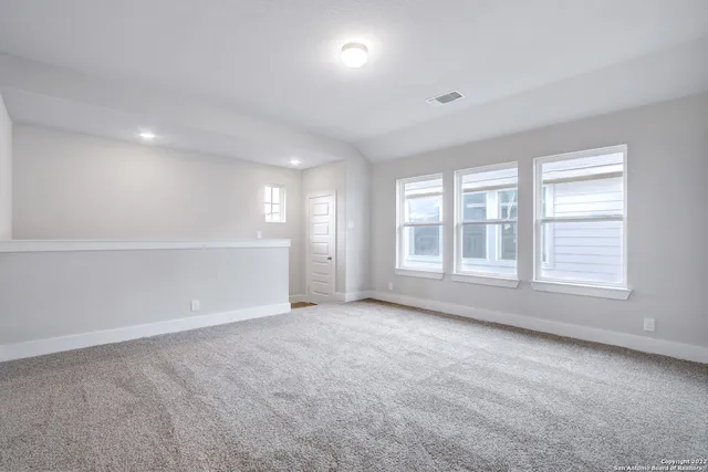 an empty room with closet area