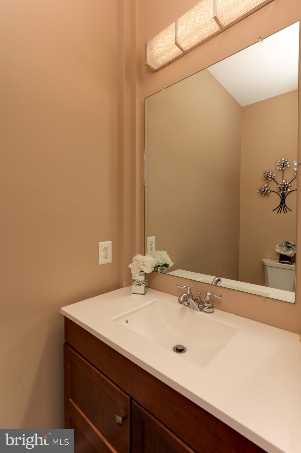 7394 Spring Summit Road Springfield, VA 22150 - Photo 10 of 69 powder room on main level next to coat closet
