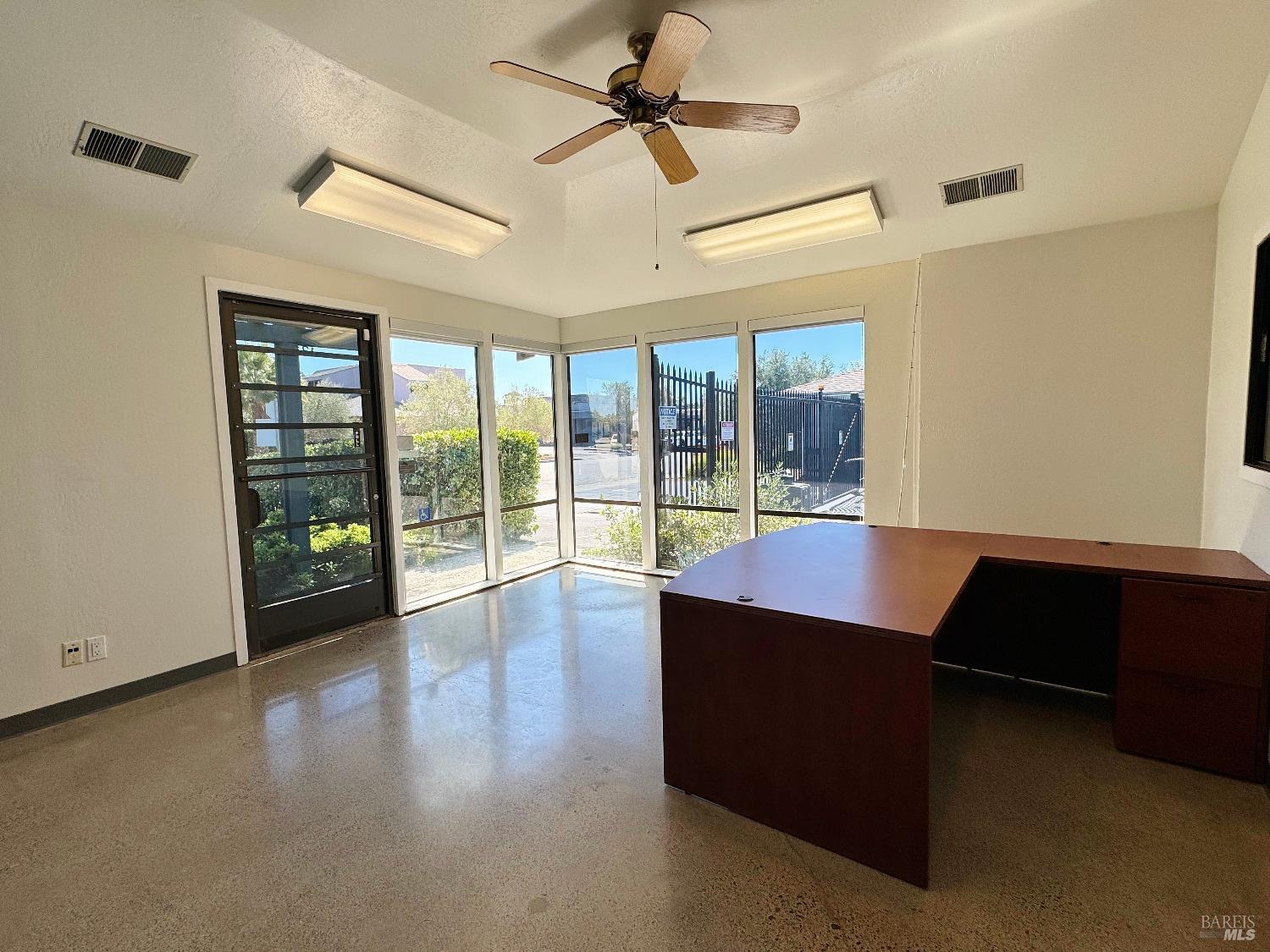 14 Commercial Boulevard, Unit 131 & Novato, CA 94949 - Photo 2 of 8 wooden floor in an empty room with a window