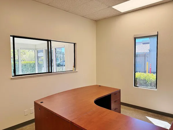 a view of an empty room with windows