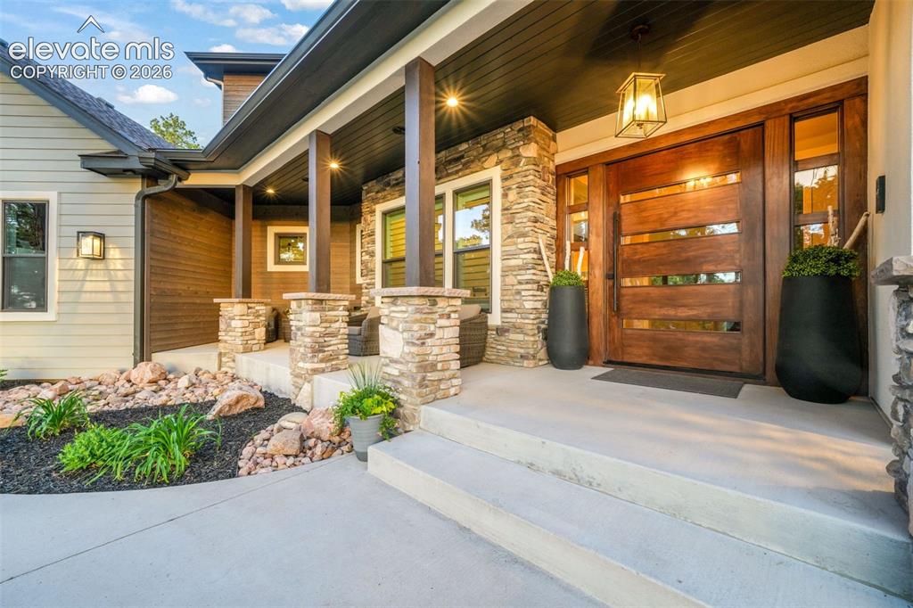 18572 Wetherill Road Monument, CO 80132 - Photo 4 of 50 Front Porch with exterior speakers