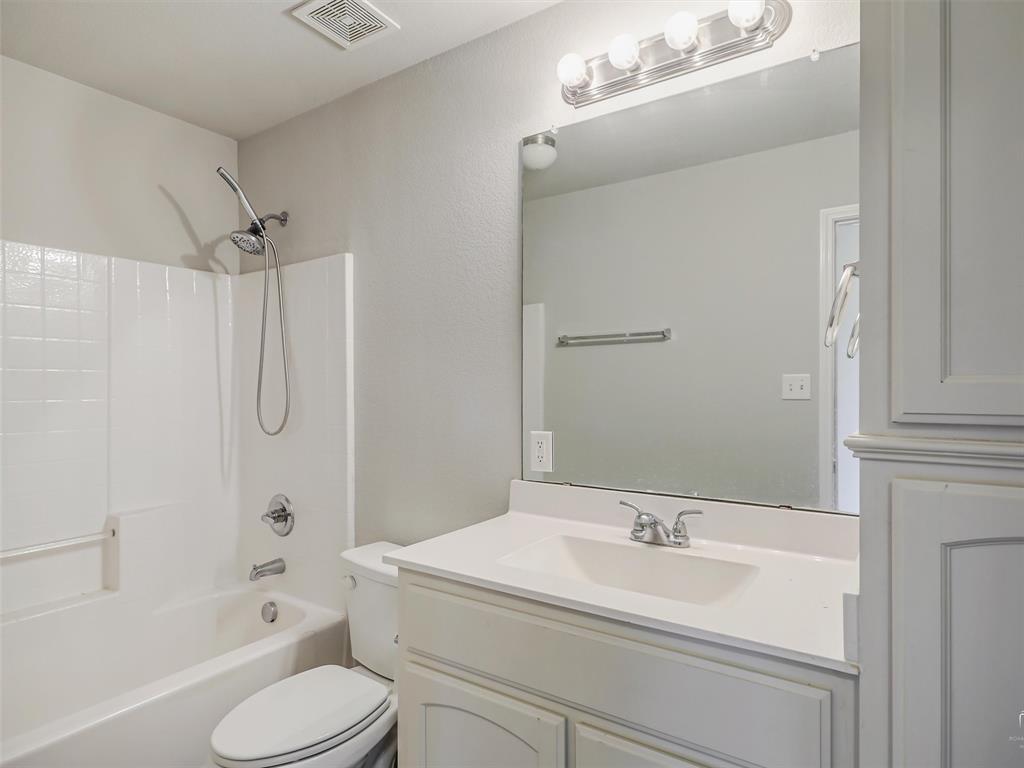 132 County Road 4213 Decatur, TX 76234 - Photo 17 of 27 a bathroom with a sink a toilet and shower