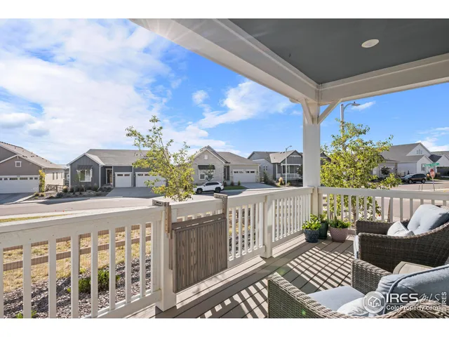 a view of a balcony with furniture