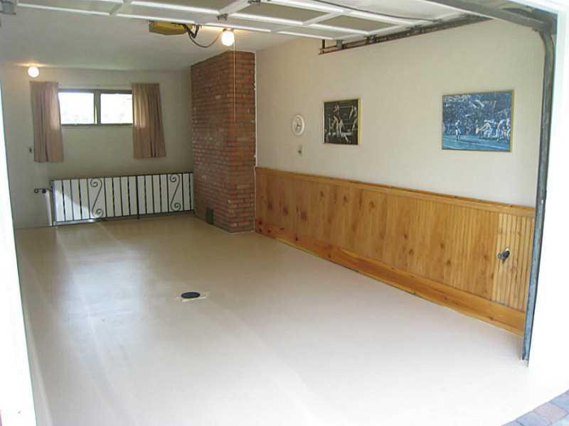 2833 Italy Road Export, PA 15632 - Photo 18 of 23 Parking Lot/Garage. Nicely finished attached oversized garage with wainscoating, plaster walls and stairs leading to the lower level.