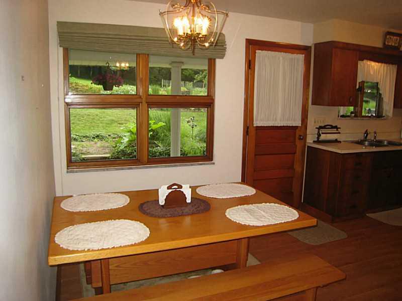 2833 Italy Road Export, PA 15632 - Photo 3 of 23 Kitchen. Fully equipped kitchen with dining area and large window and man door leading to the rear patio. Laminate flooring.