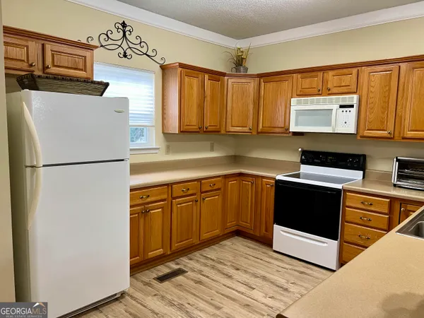a bedroom with furniture and a large window