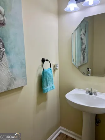 a bathroom with a shower curtain and a window