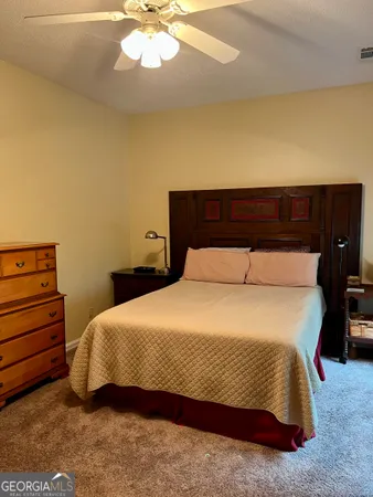 a bedroom with a bed and furniture