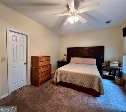 a living room with lots of furniture and a equipment