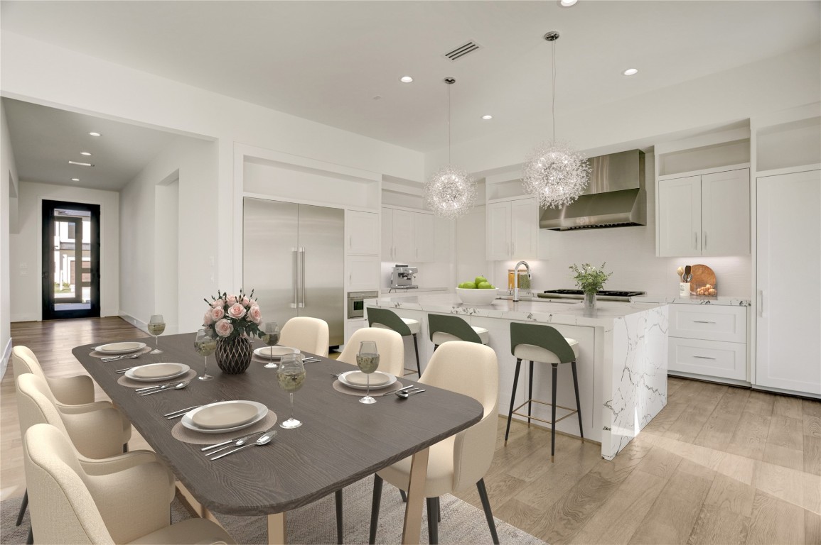 6533 Corbin Street Houston, TX 77055 - Photo 17 of 50 a kitchen with a dining table chairs and microwave