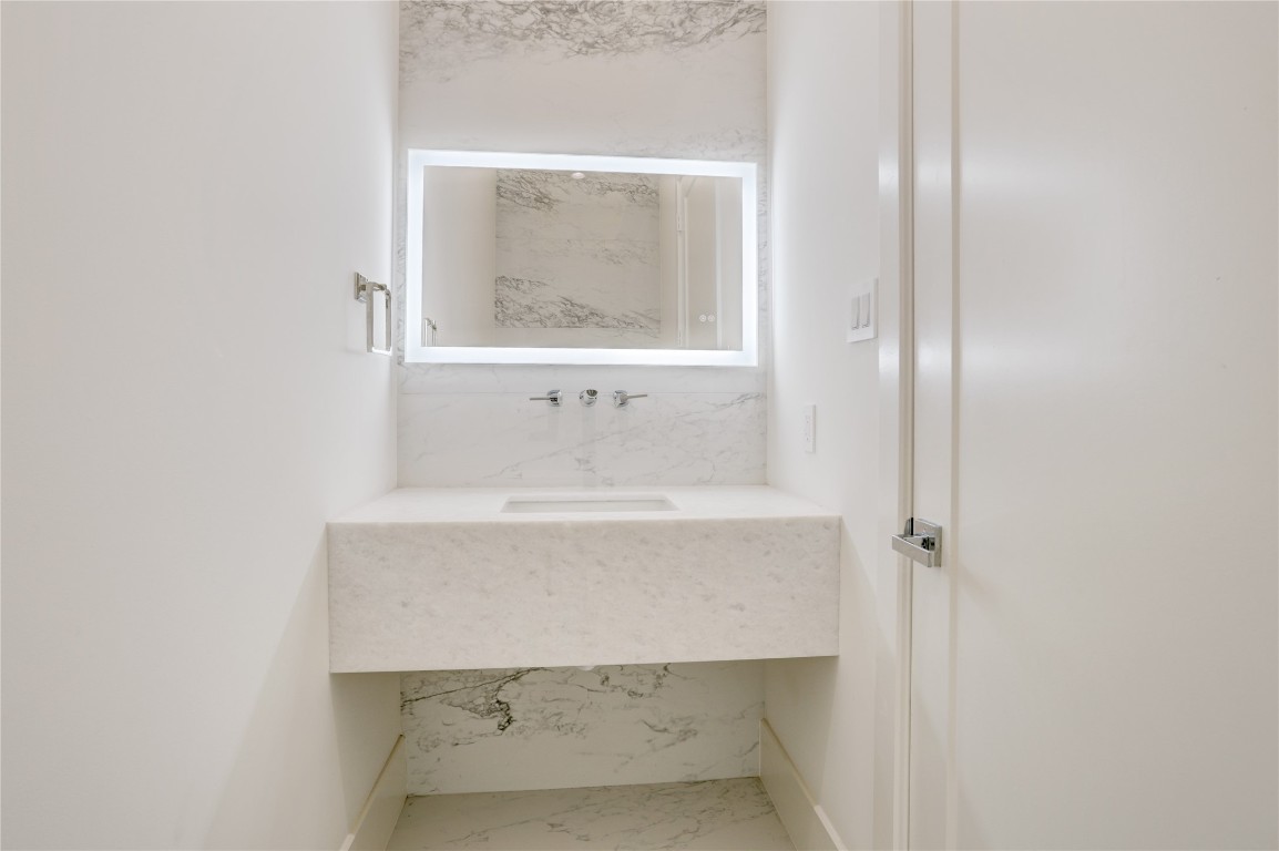 6533 Corbin Street Houston, TX 77055 - Photo 25 of 50 a bathroom with a sink and a mirror