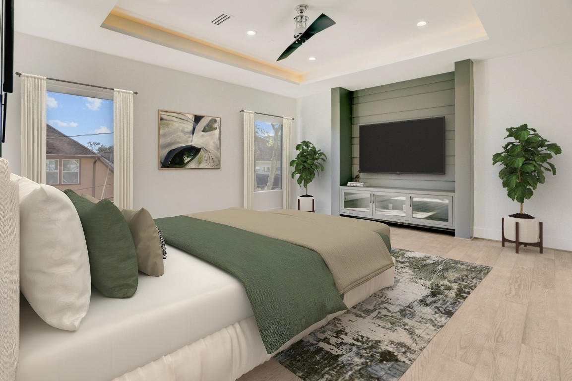 6533 Corbin Street Houston, TX 77055 - Photo 30 of 50 a bedroom with a bed and a flat screen tv