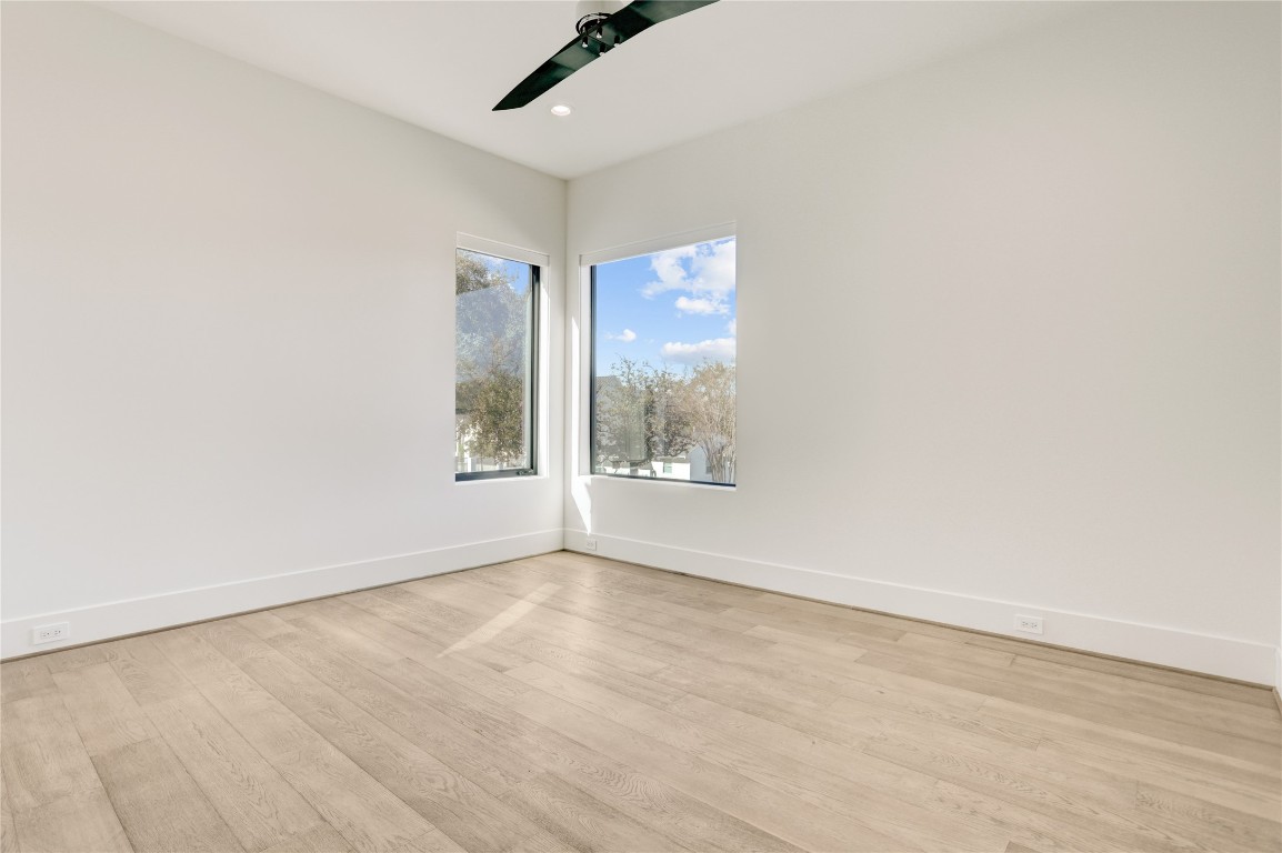 6533 Corbin Street Houston, TX 77055 - Photo 42 of 50 an empty room with wooden floor and windows