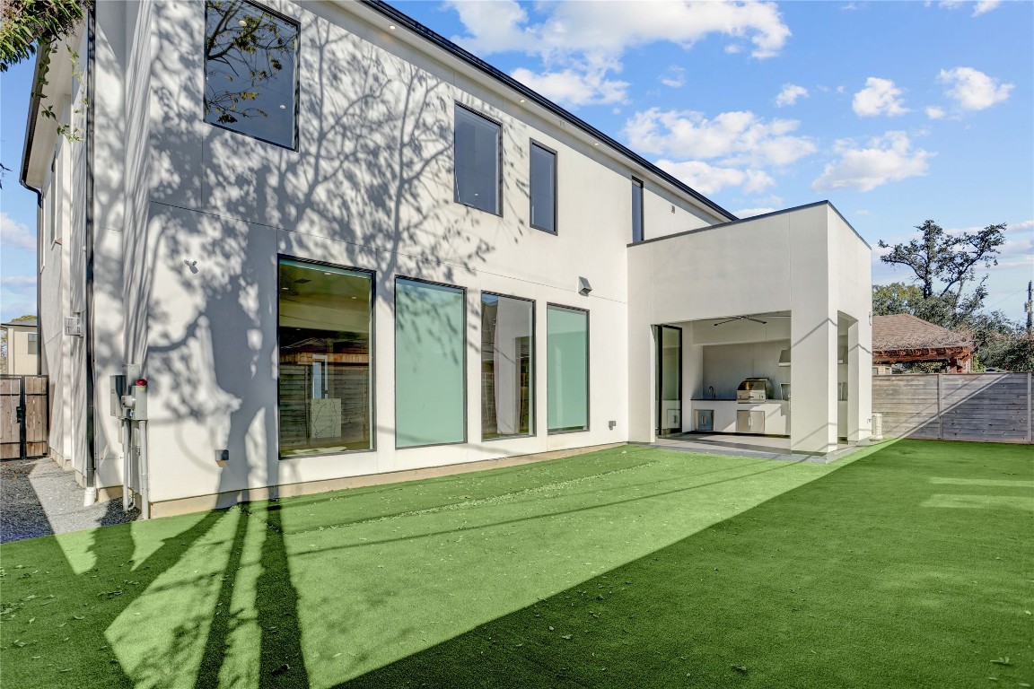 6533 Corbin Street Houston, TX 77055 - Photo 47 of 50 a view of a white house with a big yard and potted plants