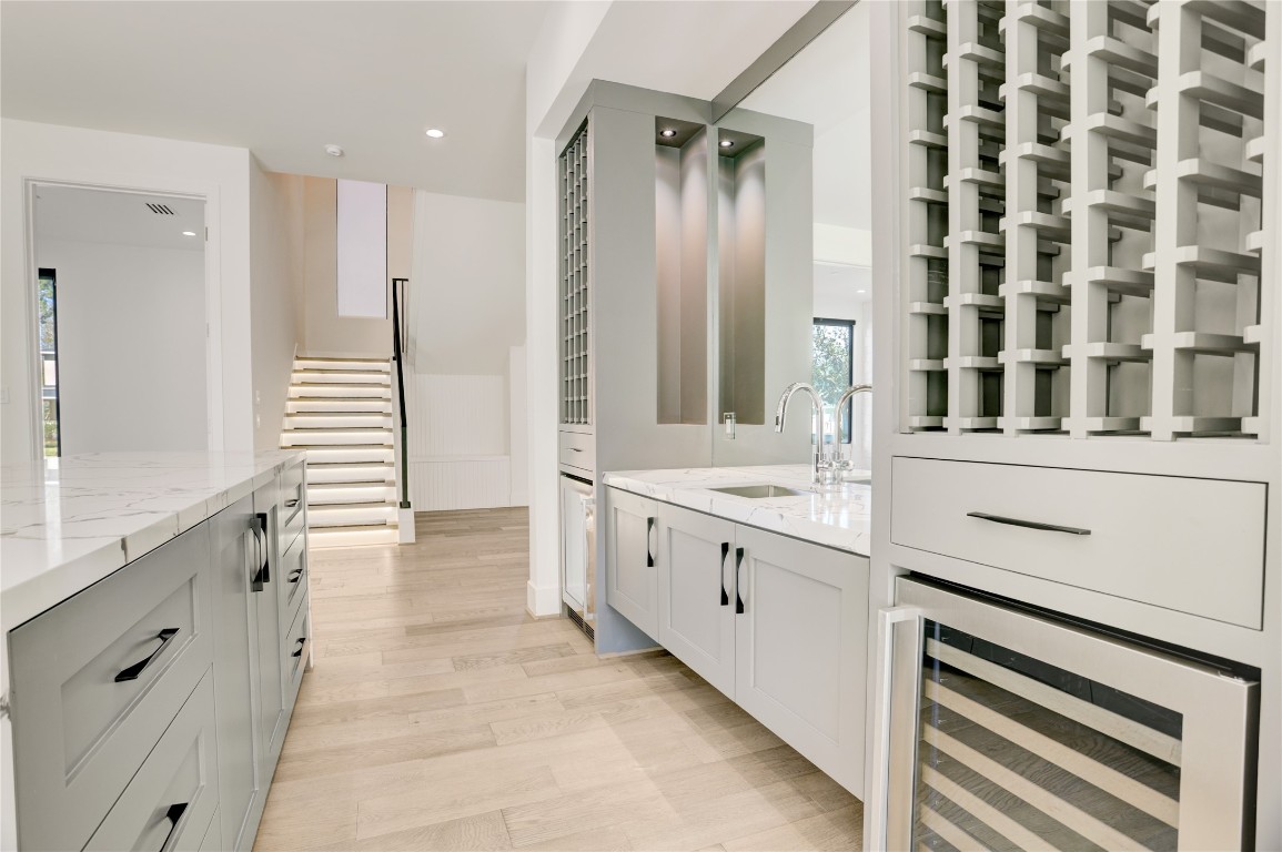 6533 Corbin Street Houston, TX 77055 - Photo 7 of 50 a large white bathroom with a granite countertop double vanity sink a mirror and a bathtub